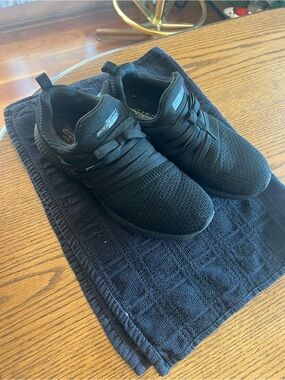Skechers Women’s Black Knit Slip-On Sneakers.